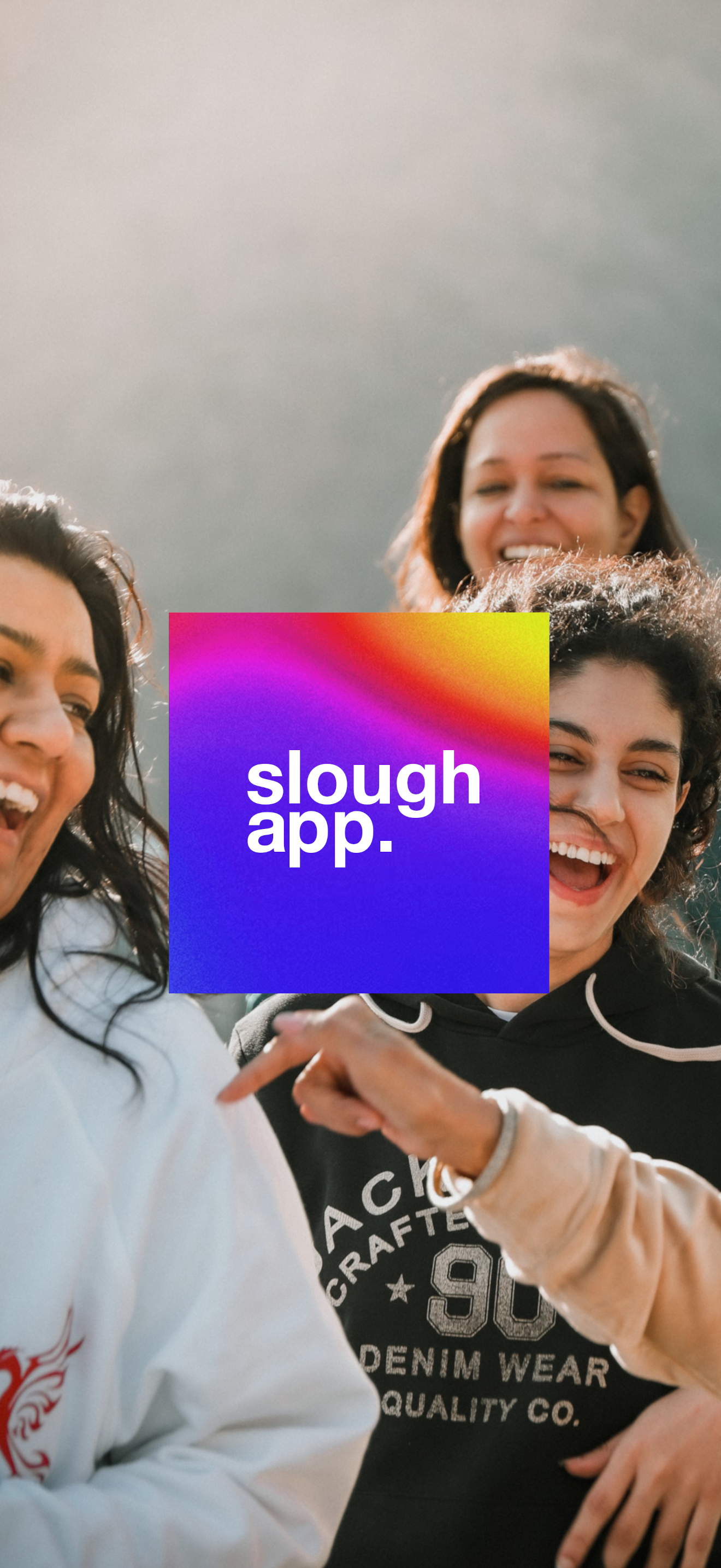 Three friends laughing together in Slough, with the Slough App logo